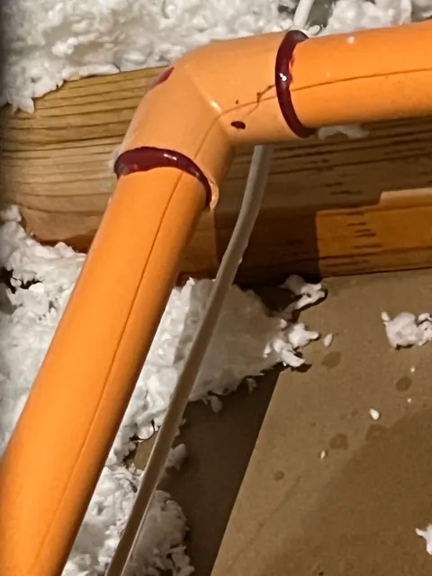 Close-up of the freeze-split fire-sprinkler pipe and elbow fitting